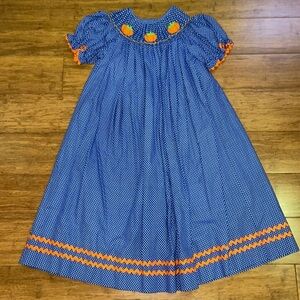 Smocked Auctions Blue Smocked Pumpkin dress size 7